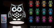 Owl-shaped night light with remote control displaying multiple colorful lights on a dark background.