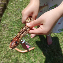 girl holding slithering snake toy
