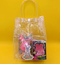 Clear plastic bag with Easter-themed items on a yellow background