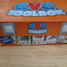 CVC Toolbox educational toy packaging on a wooden surface