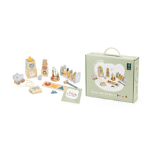 Set of wooden toys with packaging on a white background