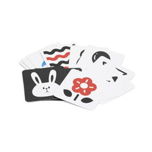Set of playing cards with cartoon character designs on a white background