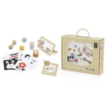 Children's educational toy set with cards and wooden toys next to its packaging on a white background