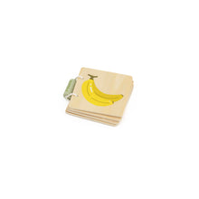 Stack of children's books with a banana illustration on the cover against a white background