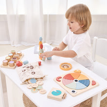 Child playing with wooden toys stacking creative blocks