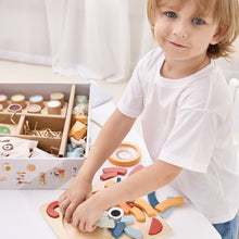 3 year old playing with wooden toys educational toys