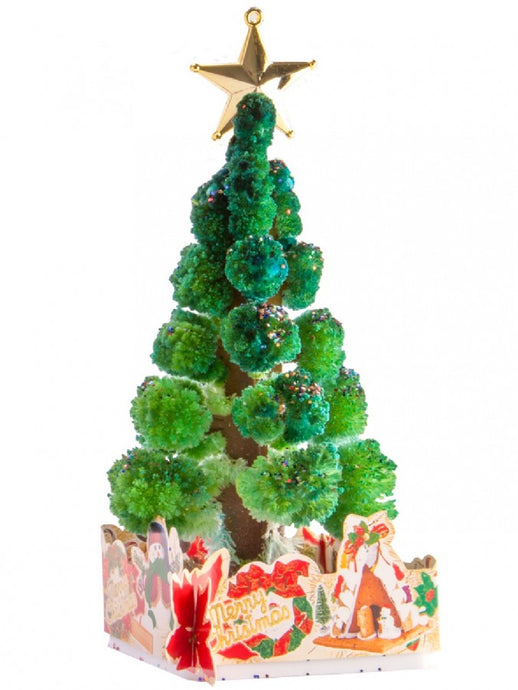 Decorative Christmas tree with a star on top, placed on a colorful base with festive designs.