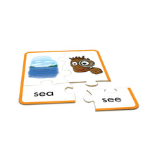 Educational puzzle with a cartoon character and word cards on a white background