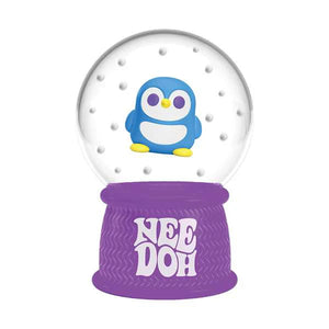 Snow globe with a penguin design on a purple base, featuring the brand 'Nee Doh'.