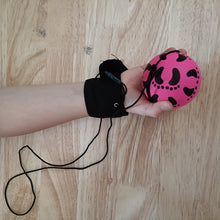 Kids hand throwing yo-yo ball