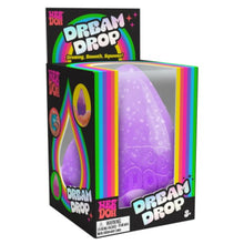 Purple 'Dream Drop' toy in packaging with colorful text and graphics.