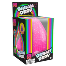 Pink toy with 'Dream Drop' branding in a colorful box on a white background