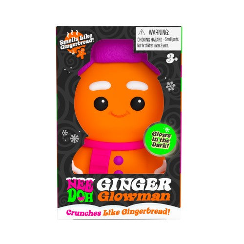 Gingerbread-themed toy packaging with orange character wearing a pink hat and scarf.
