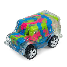 Colorful toy car with transparent body on a white background