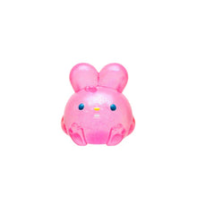 Pink cartoon-like figure on a white background