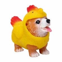 Dog figurine wearing a yellow chicken costume on a white background