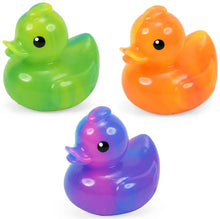 Three colorful rubber ducks in green, orange, and purple on a white background