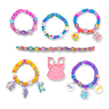 Colorful children's bracelets with charms on a white background