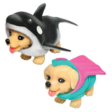 Two toy figures of puppies wearing animal-themed hats on a white background