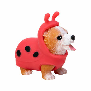 Dog figurine wearing a red ladybug costume on a white background