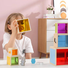 Child looking through a coloured window 
