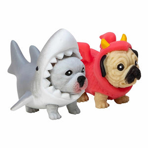 Two toy figures of a shark and a dog in a red costume on a white background