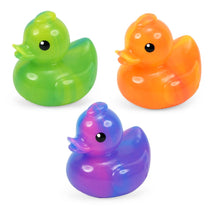Three colorful rubber duckies in green, orange, and purple on a white background
