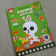A children's activity book titled 'My First Dot-To-Dot Adorable Animals' by Party Pals, featuring a colorful cover with a cartoon white rabbit on a green background and numbered dot trails along the bottom.