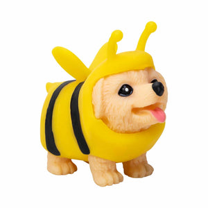 Toy figure of a dog dressed as a bee on a white background