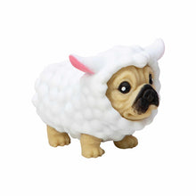 Dog figurine wearing a sheep costume with a pink lamb tag on a white background