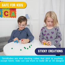 Two children playing with Sticky Creations at a table.