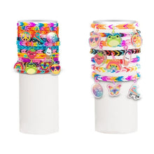 Two cylindrical containers filled with colorful hair ties and bracelets on a white background