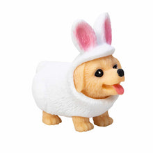 Small dog figurine wearing a white sweater and bunny ears on a white background