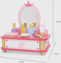 Pink toy vanity set with mirror, drawers, and various accessories on a white background.