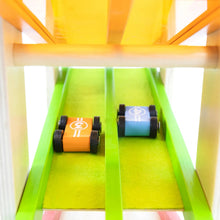 Toy cars on a colorful plastic track with a white background